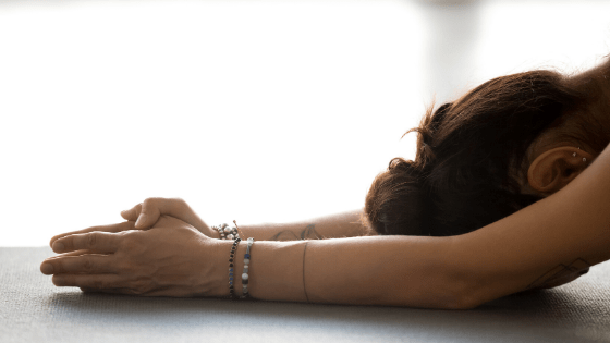 woman setting intention during yoga